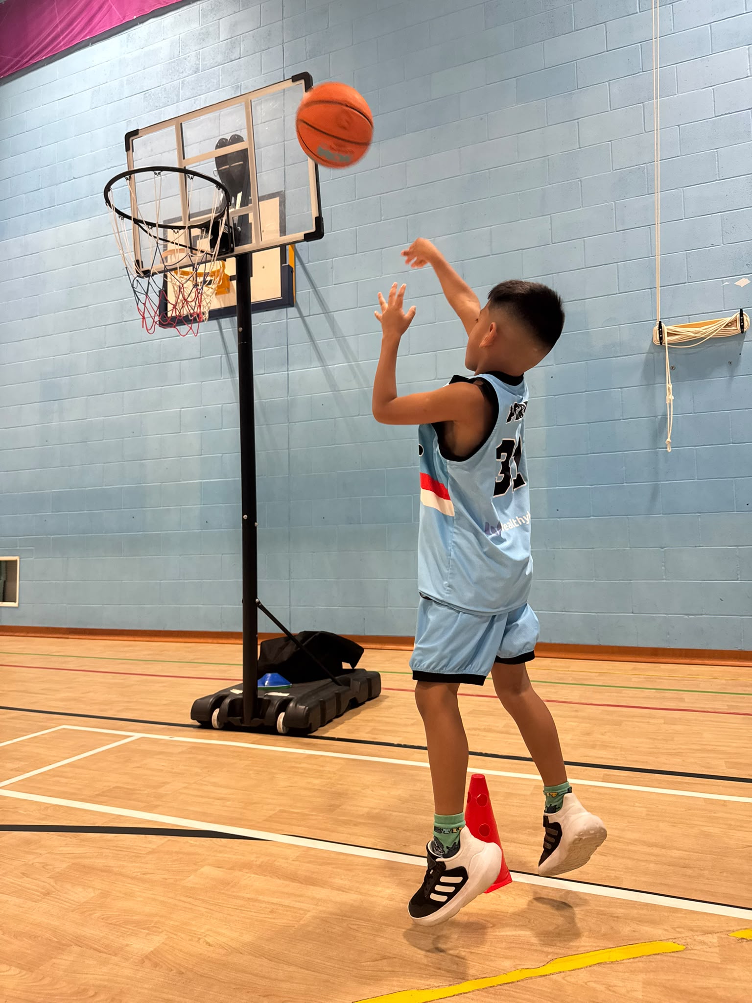 Junior Bulls player shooting a basketball