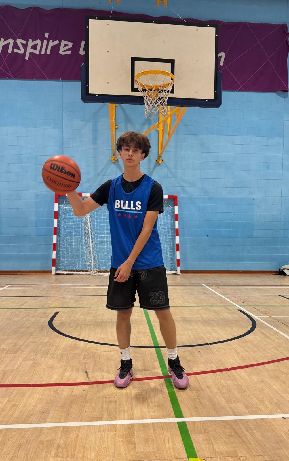 Senior Bulls player on court with a basketball